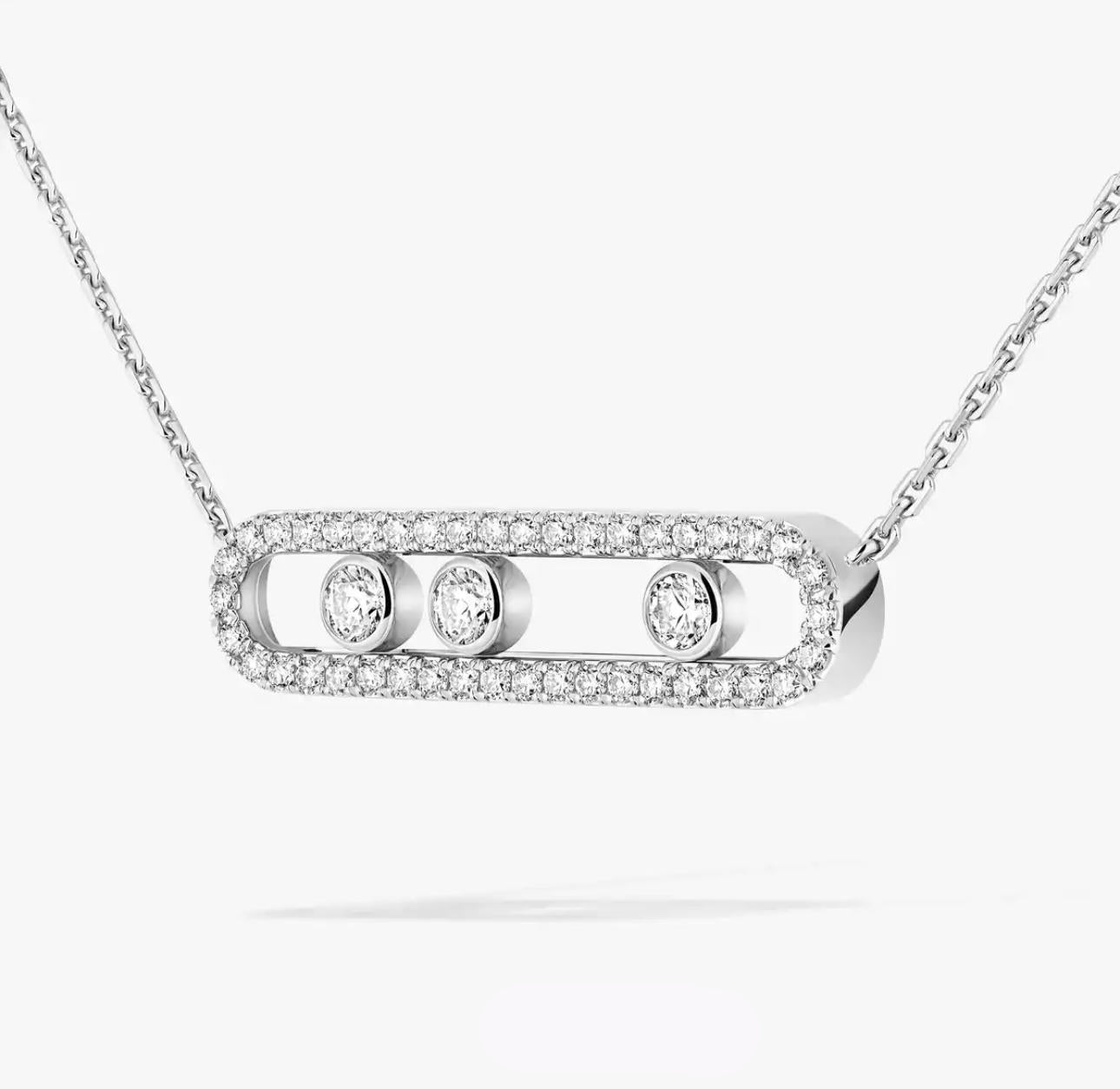 Silver necklace with a diamond pendant on a white background