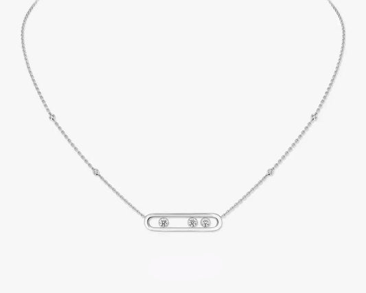 Silver necklace with a rectangular pendant on a white background