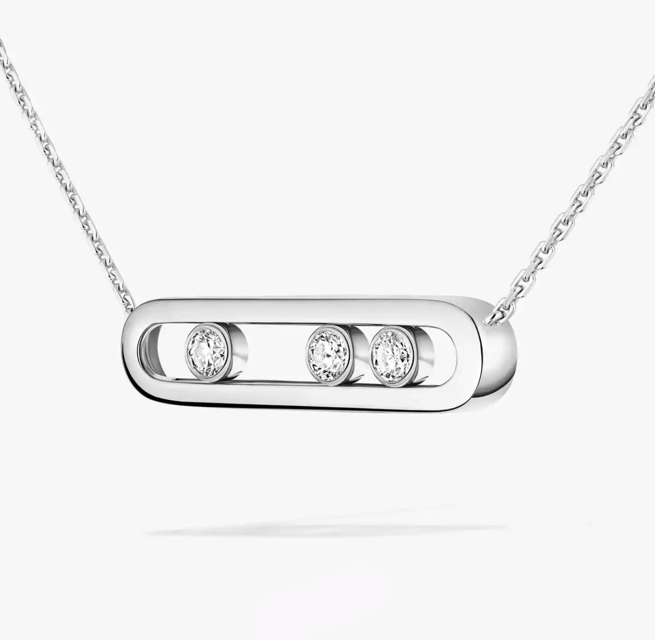 Silver necklace with three circular gemstones on a white background
