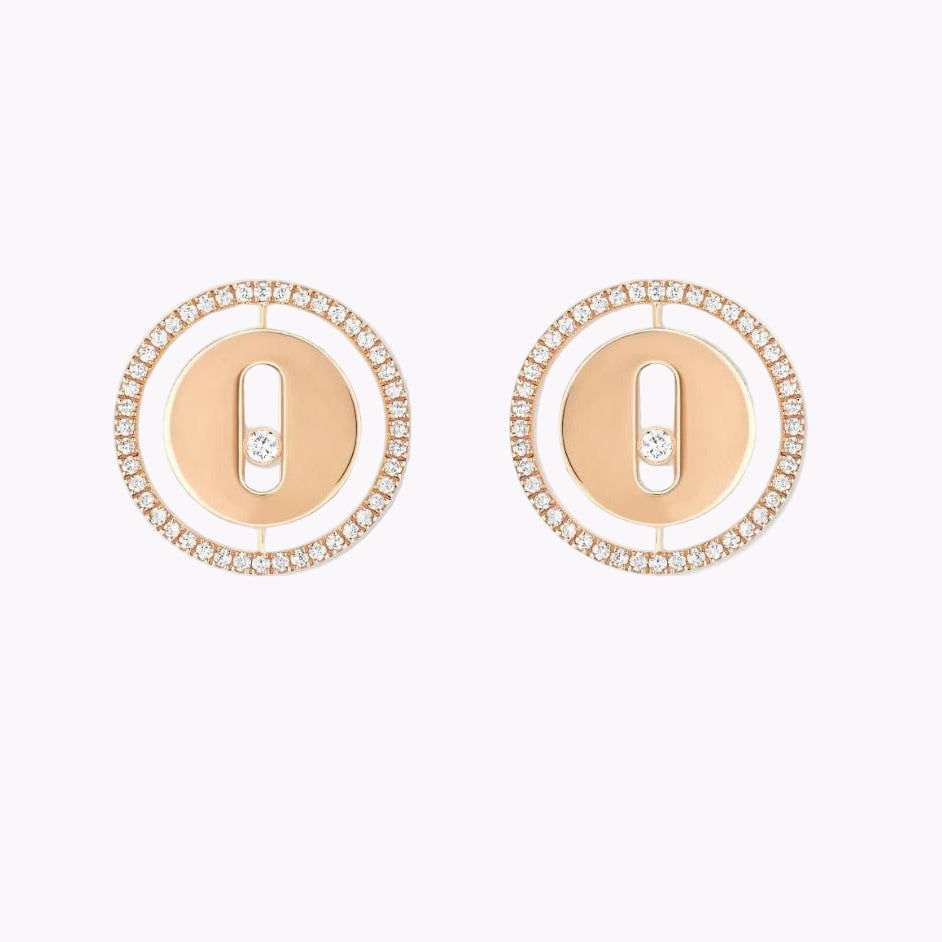 Pair of Messika earrings on a white background