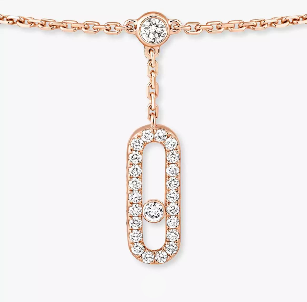 Rose gold necklace with diamond pendant on a white background