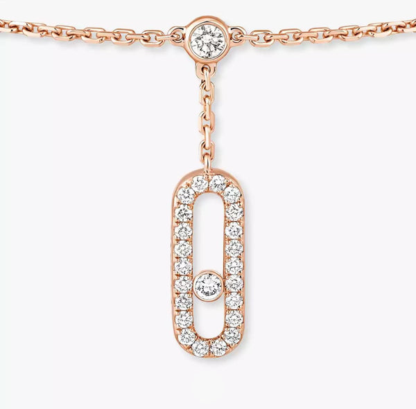 Rose gold necklace with diamond pendant on a white background