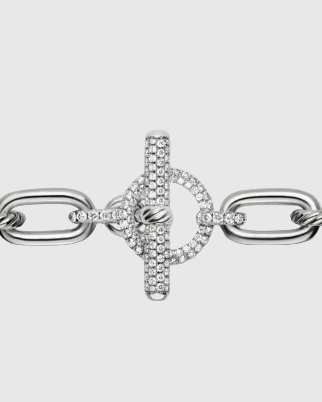 Extreme close-up of the front-facing toggle clasp on the silver chain, showcasing the 2.28 carats of micro-pavé brilliant stones set into the T-bar and circular loop.