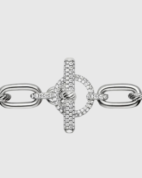 Extreme close-up of the front-facing toggle clasp on the silver chain, showcasing the 2.28 carats of micro-pavé brilliant stones set into the T-bar and circular loop.
