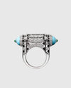 Front view of the 38.3mm wide cylindrical 925 silver statement ring, showcasing geometric black lacquer lines and brilliant-cut zircon pavé setting.