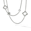 A sterling silver necklace with a four-pointed star pendant and a chain of linked stars.