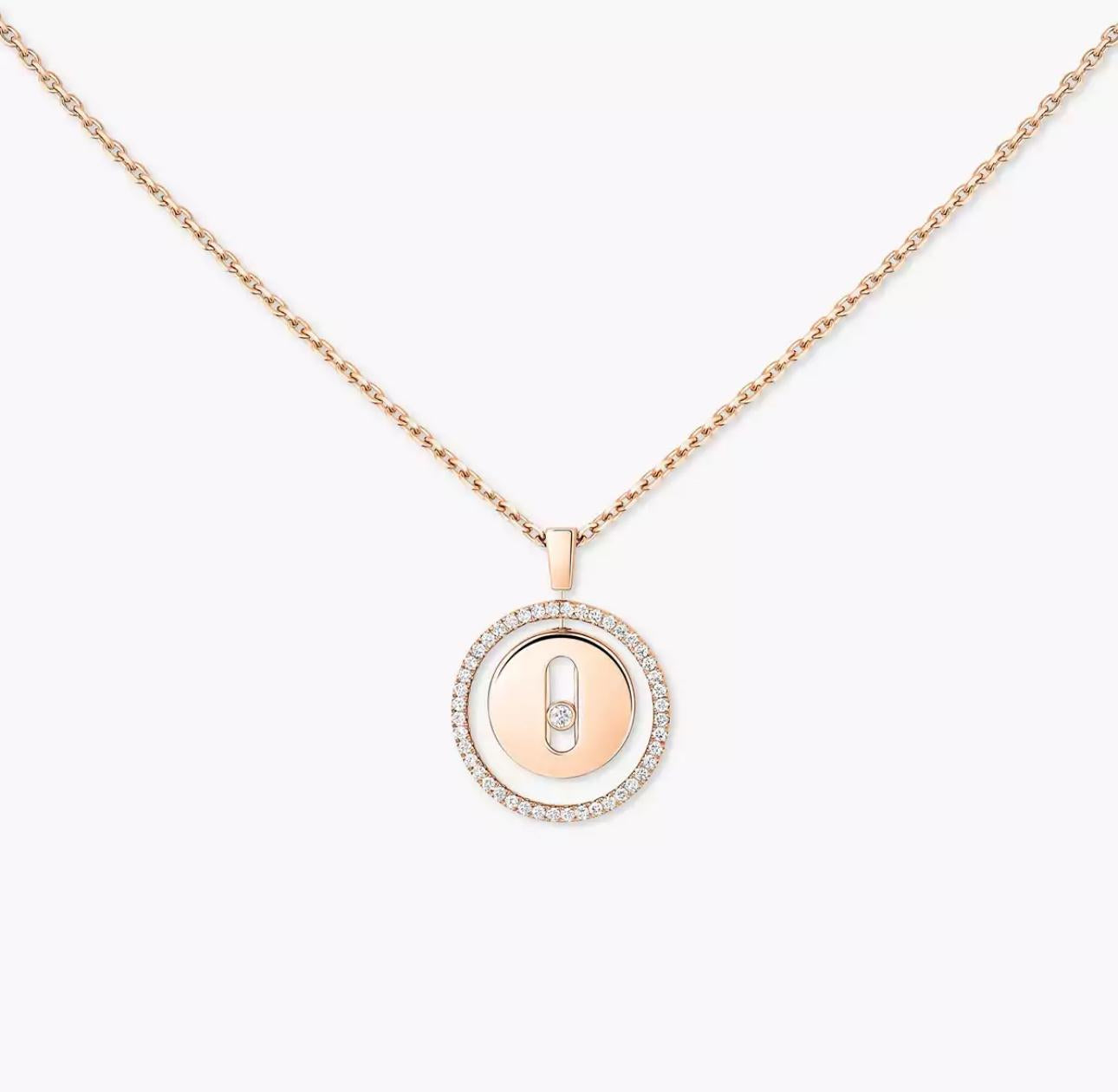 Rose gold necklace with a round pendant on a white background