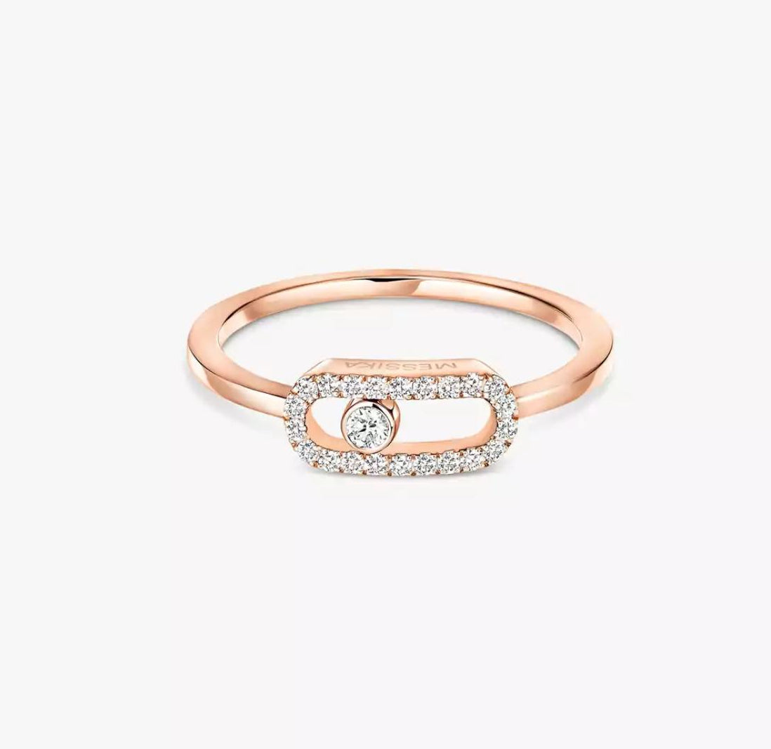 Rose Gold Move Uno ring with a diamond on a white background