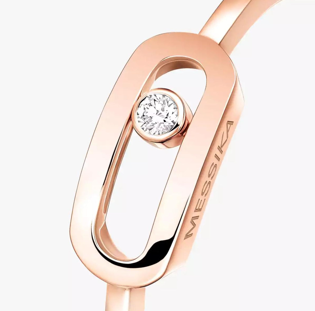 Rose gold Move Uno ring with a diamond on a white background