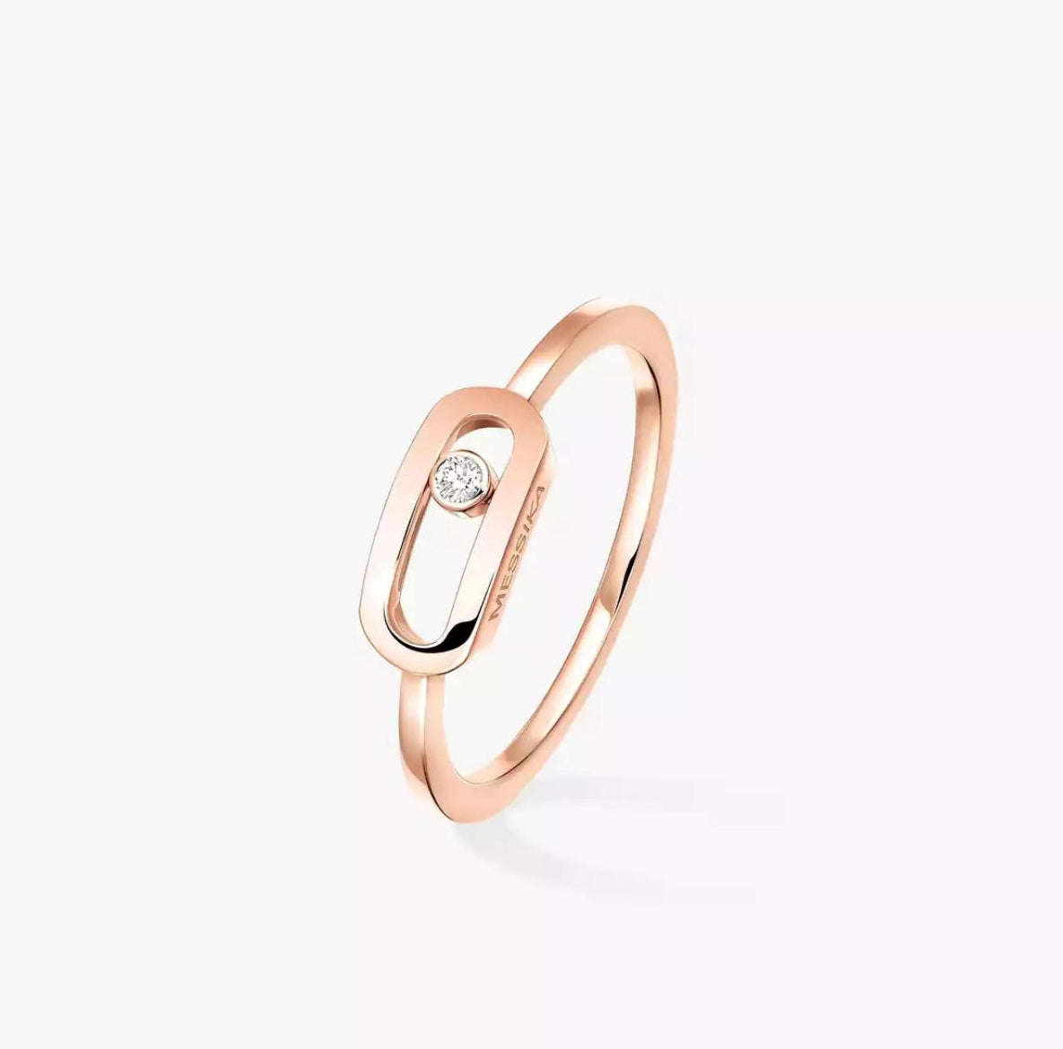 Rose gold Move Uno ring with a diamond on a white background