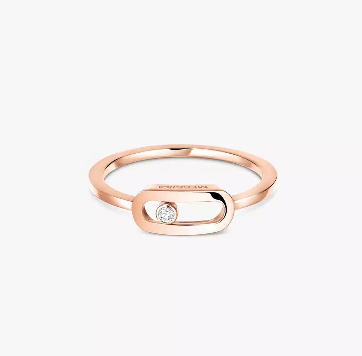 Rose gold Move Uno ring with a diamond on a white background