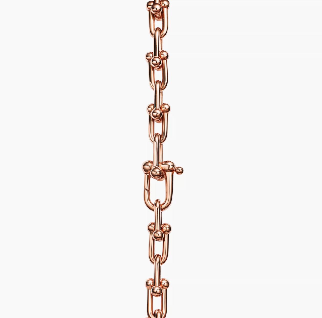 Rose gold chain on a white background