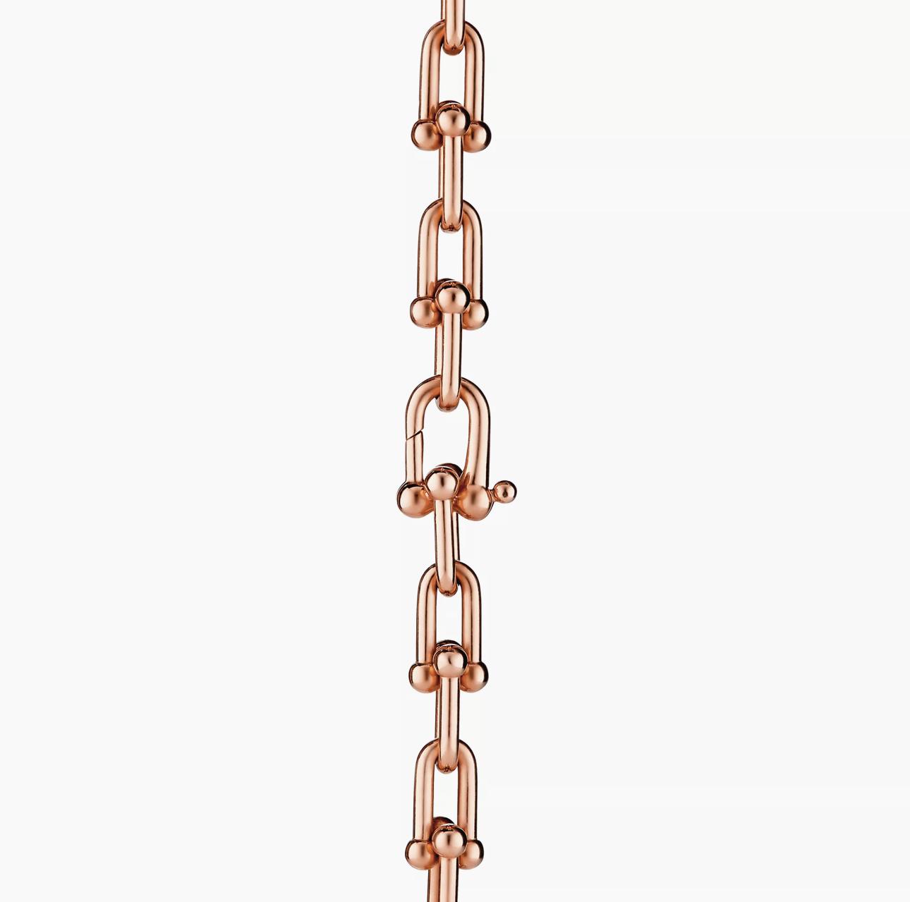 Rose gold chain on a white background