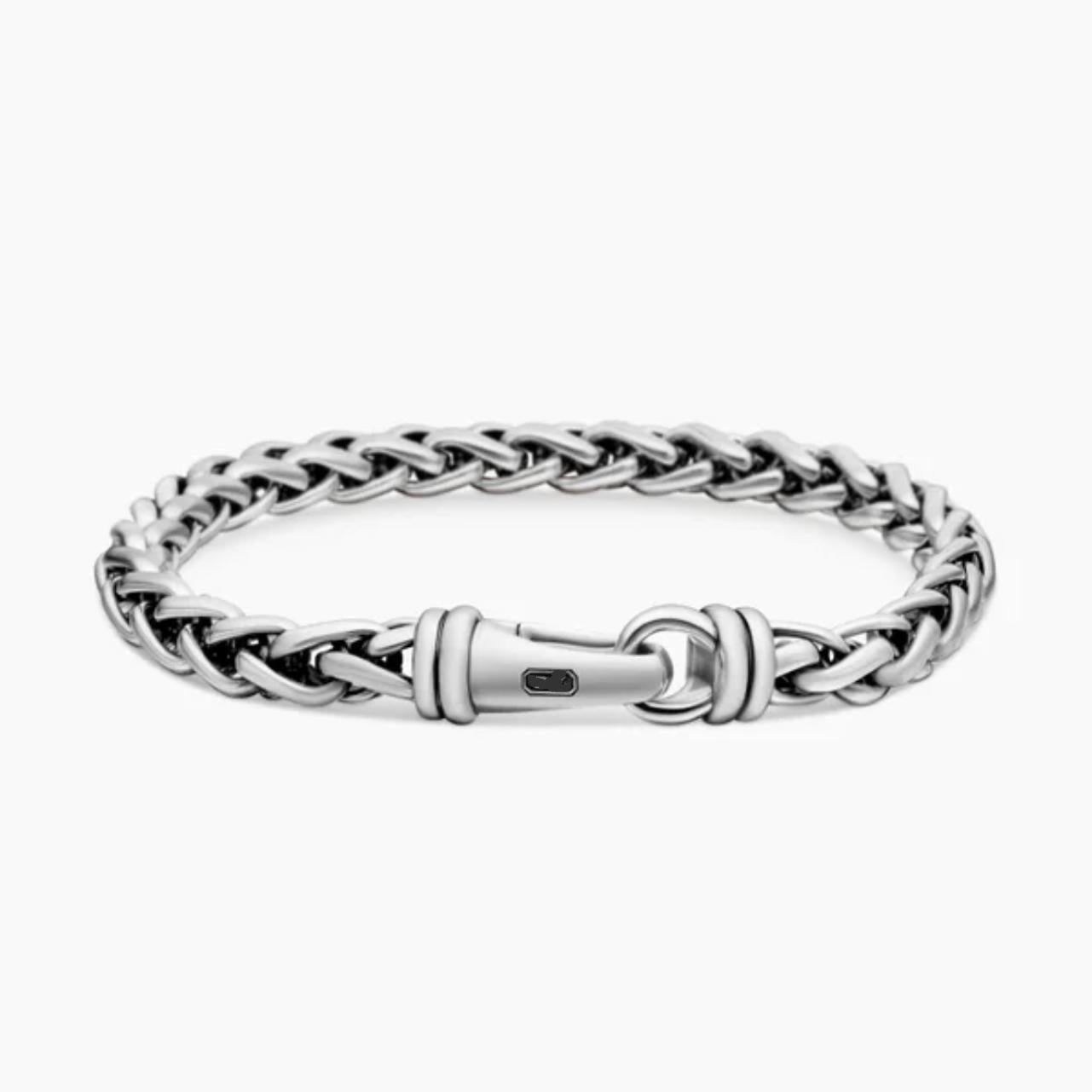 Silver chain bracelet on a white background