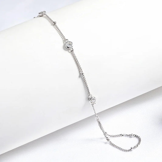 Silver bracelet with small crystals on a white background