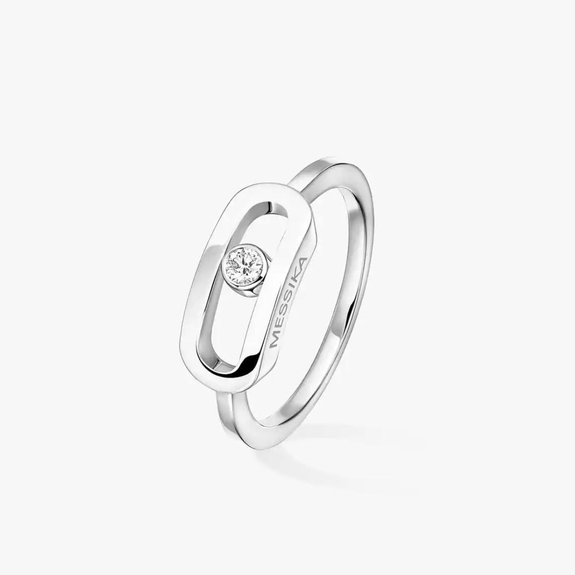 Silver ring with a diamond on a white background