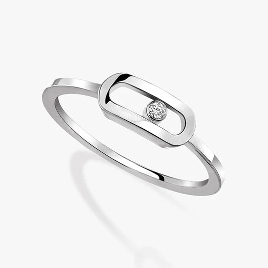 Silver ring with a small diamond on a white background