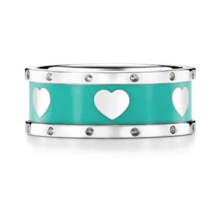 Sterling silver ring with Tiffany Blue® enamel finish with heart designs on a white background
