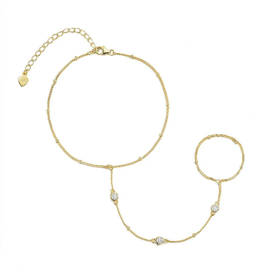 Gold hand set with clasp on a white background