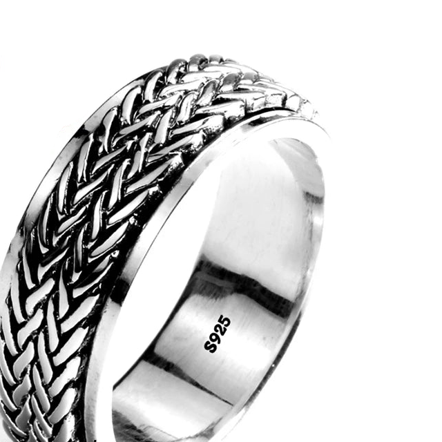 Silver ring with braided design and '925 Sterling Silver' stamp on a white background