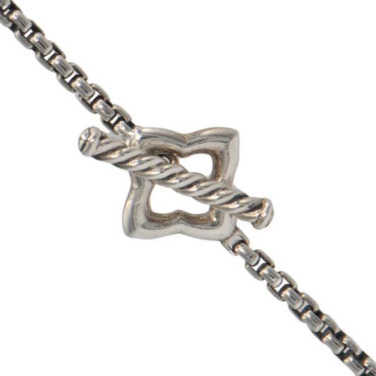 Silver bracelet with a star-shaped clasp on a white background