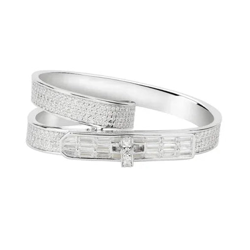 gold ring with diamond accents on a white background