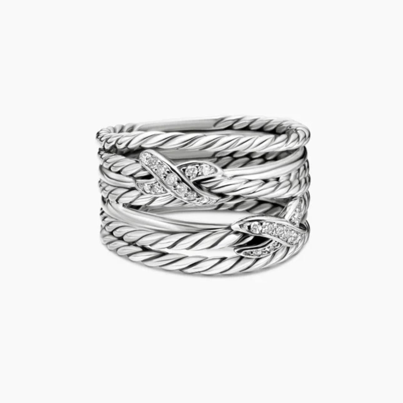 Set of silver rings with diamond accents on a white background