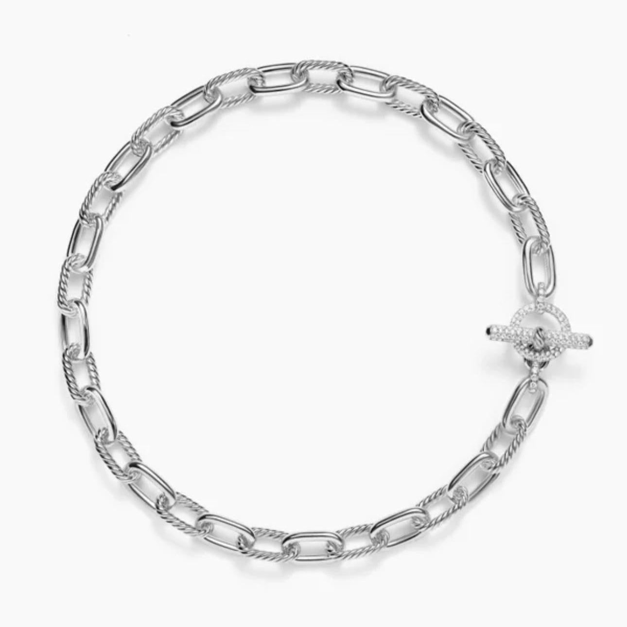 Silver chain bracelet on a white background