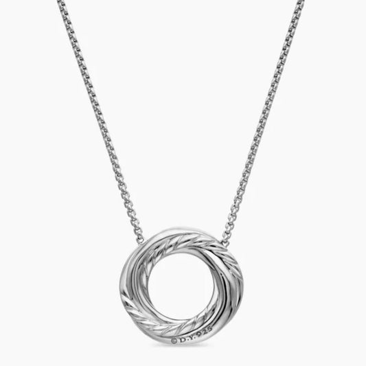 Silver necklace with a circular pendant on a white background
