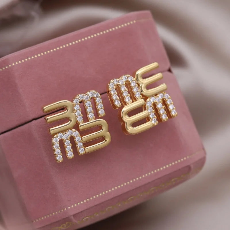 Mésara Earrings | 18K Gold Jewelry | “M” Initial Studs