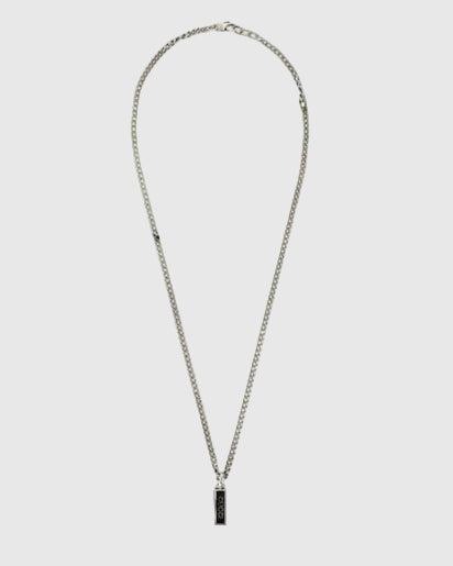 Necklace with a black pendant on a light gray background