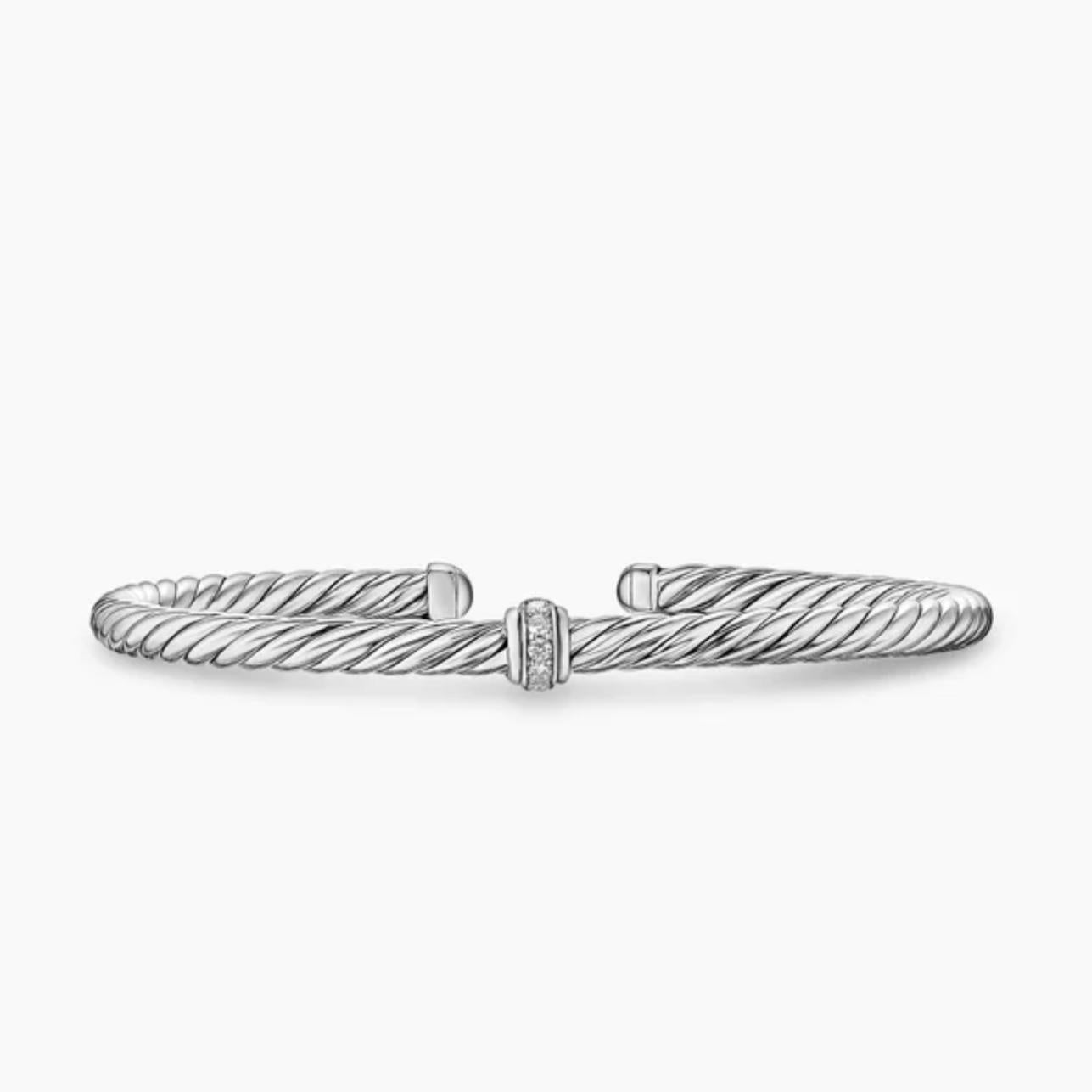 Silver bracelet with a diamond on a white background
