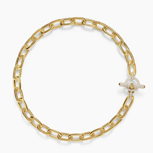 Gold chain bracelet with a Toggle clasp on a white background