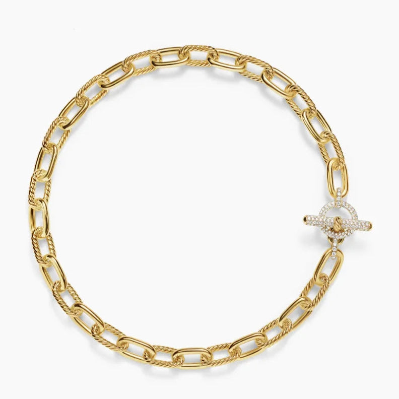 Gold chain bracelet with a clasp on a white background