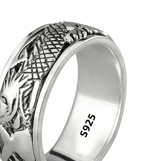 Silver ring with dragon design and '925 Sterling Silver' stamp on a white background