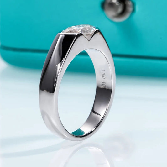 A marquise-cut moissanite ring with a 1ct D-color VVS1 clarity, set in sterling silver and plated in 18K white gold.