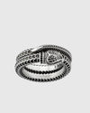 Close-up of the sculpted solid silver snake head and the coiled double-band silhouette, highlighting the antique Italian craftsmanship.
