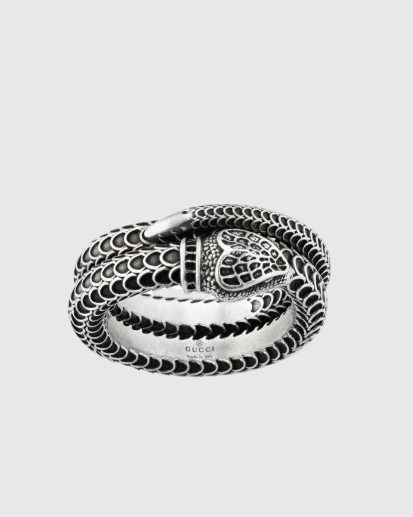 Close-up of the sculpted solid silver snake head and the coiled double-band silhouette, highlighting the antique Italian craftsmanship.