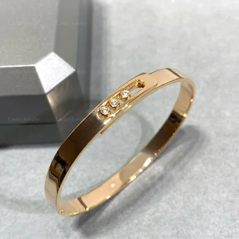Move Noa Bangle | 18K Gold & Triple Floating Zircon