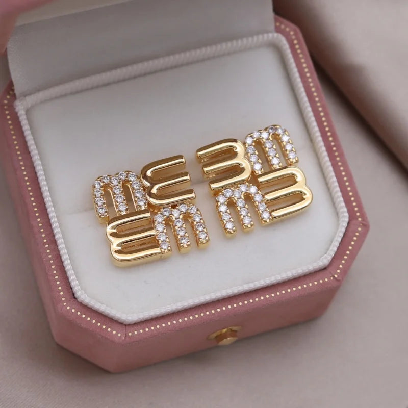 Mésara Earrings | 18K Gold Jewelry | “M” Initial Studs
