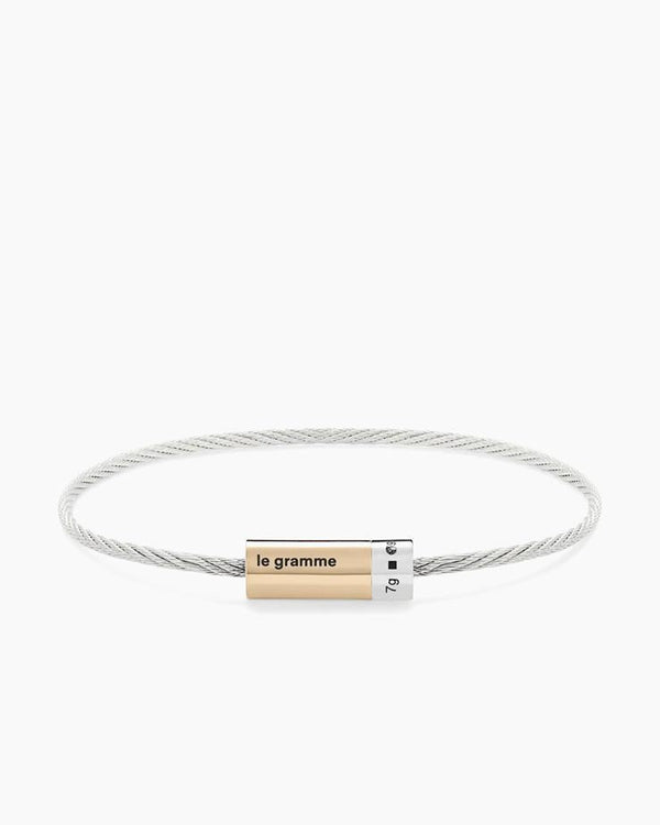 Bracelet with a gold tag on a white background