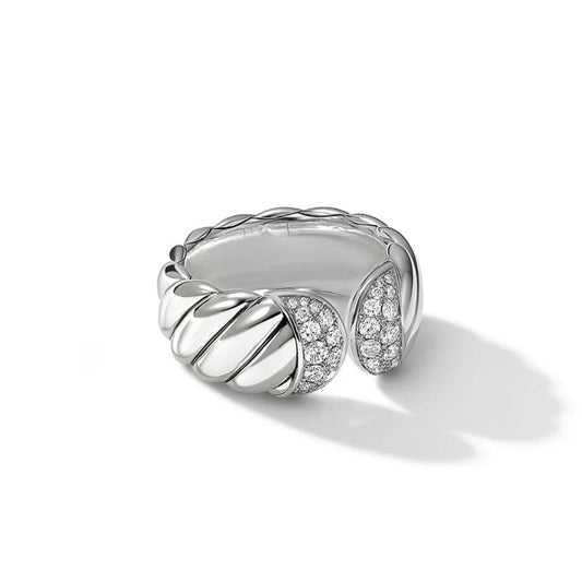 Silver ring with diamond accents on a white background