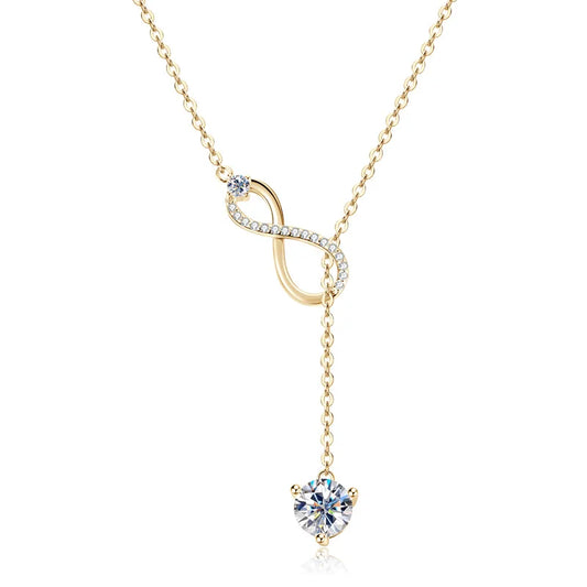 Gold necklace with a diamond pendant on a white background