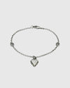 Aerion Cuore 925 sterling silver chain bracelet featuring interlocking monogram charms and an ornately engraved vintage heart pendant.