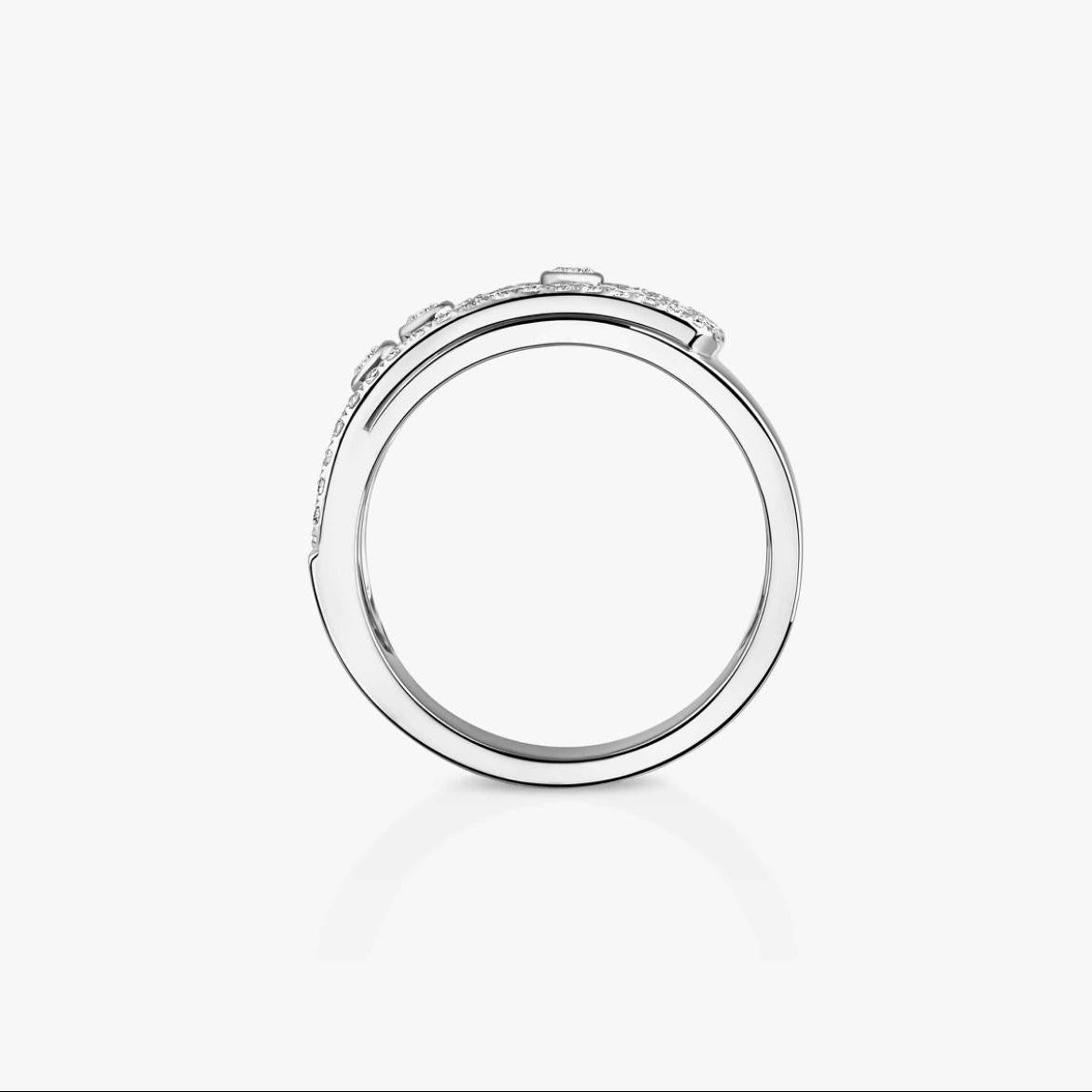 Silver ring with a clear gemstone on a white background