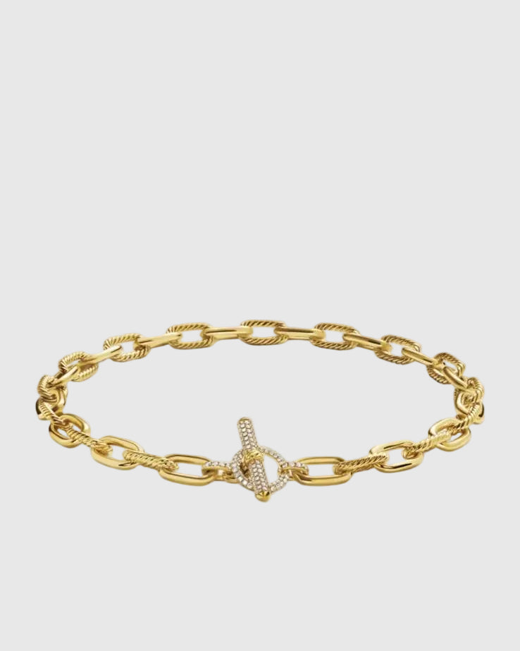Angled view of the Claspéra Madison gold-plated sterling silver necklace, demonstrating the heavy, substantial feel of the 11mm architectural links.