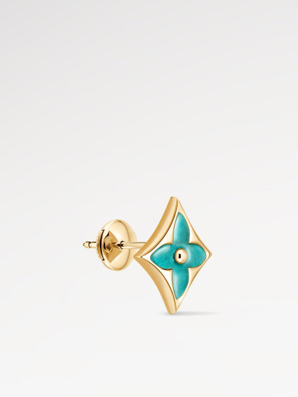 Gold and turquoise Star Ear Stud on a light gray background