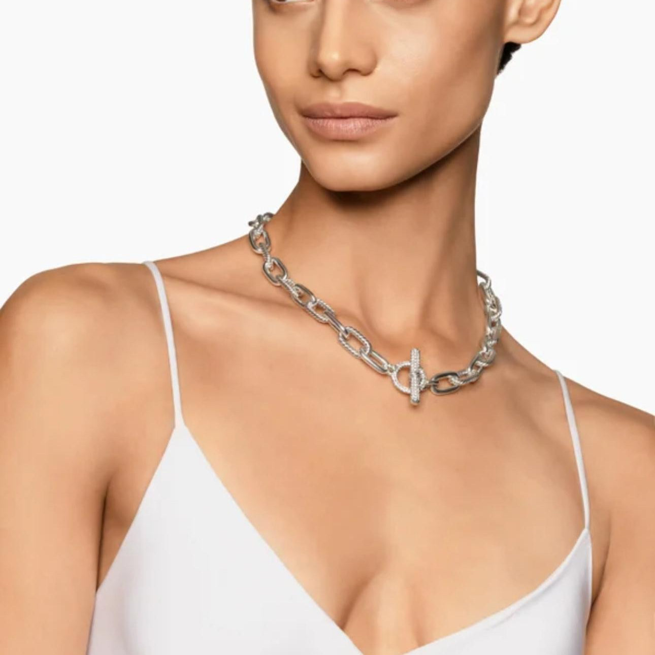 Woman wearing a Sterling Silver with Diamonds, 11mm chain necklace on a white background