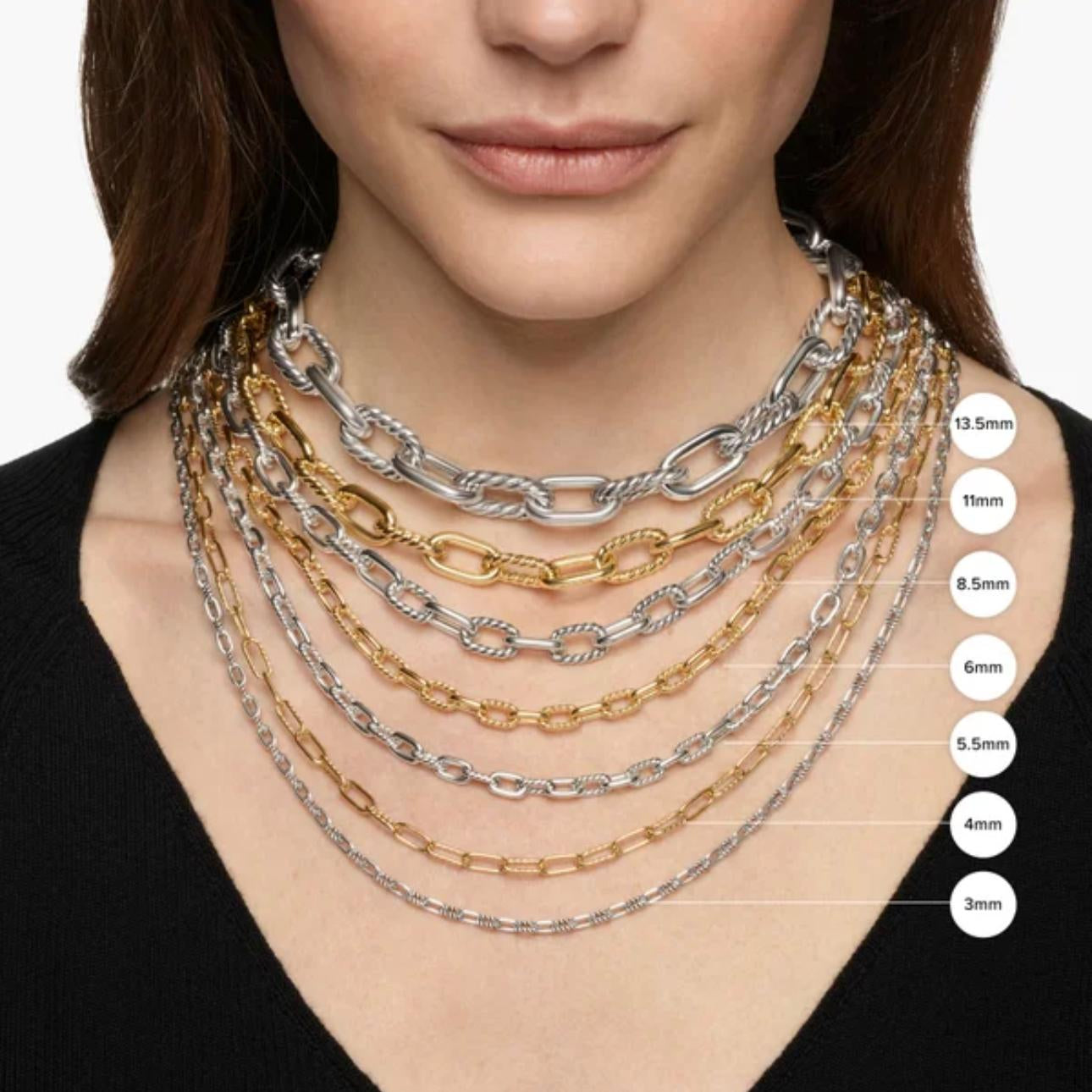 Woman wearing multiple necklaces with a clear background