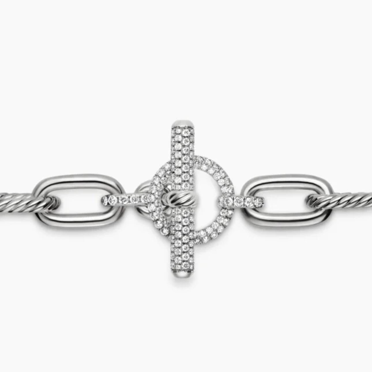 Close up Silver chain bracelet with a Pave Toggle clasp on a white background